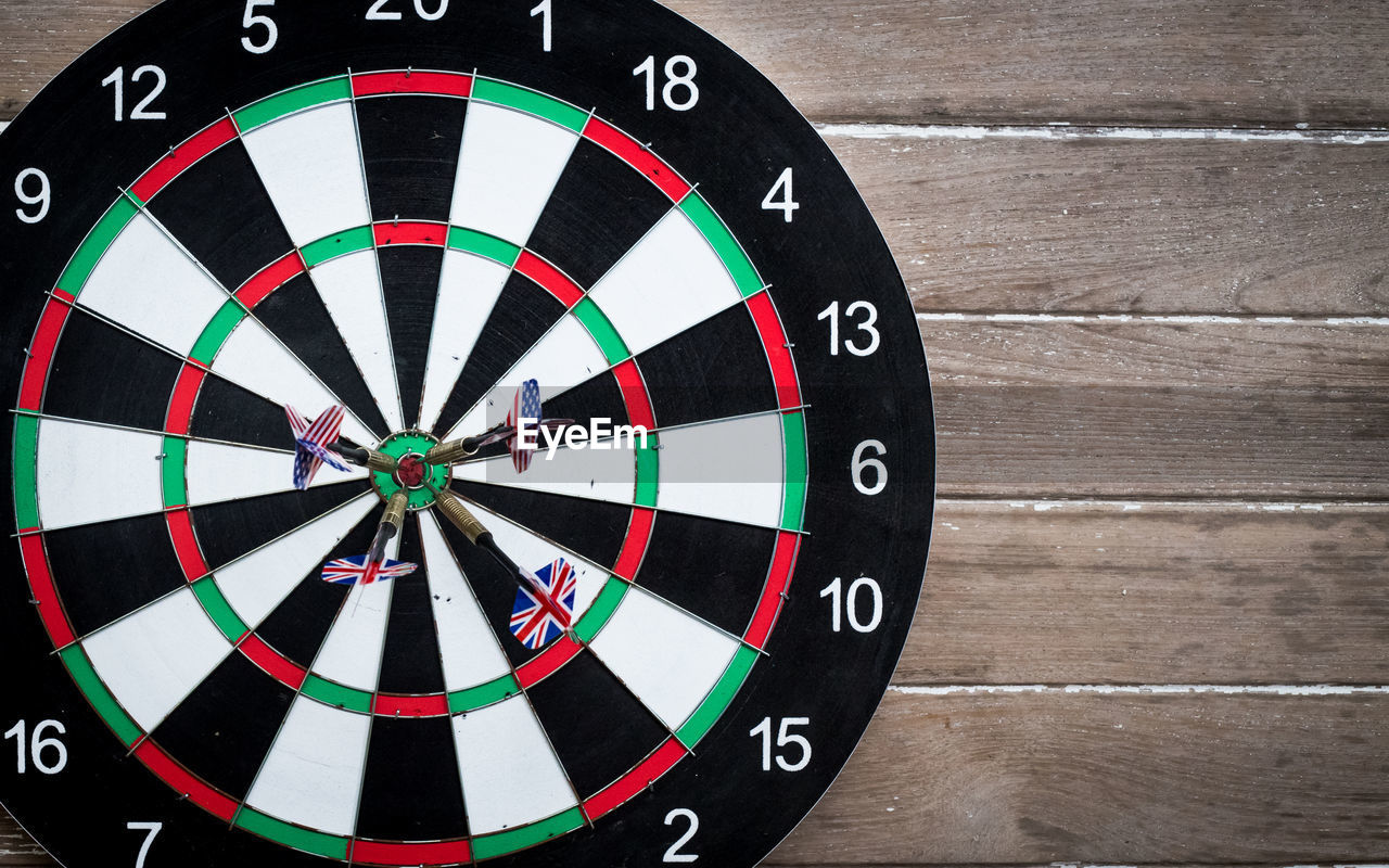 Close-up of arrows on dart board