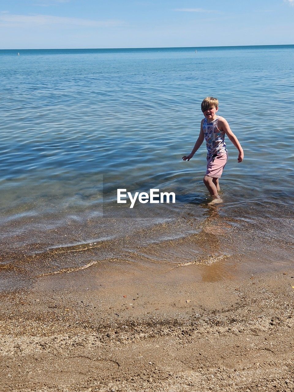 water, one person, blue, nature, day, leisure activity, lifestyles, full length, sports, motion, sea, swimming, outdoors, adult, men, vitality, jumping, mid-air, sunlight, vacation, trip, person, holiday, young adult, wave, enjoyment, fun, swimwear