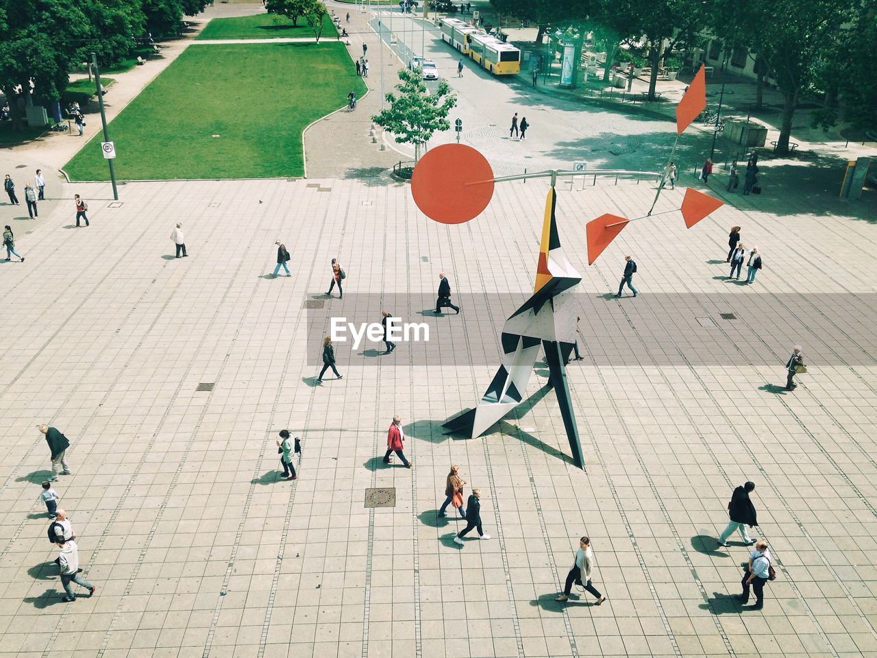 High angle view of people walking on footpath