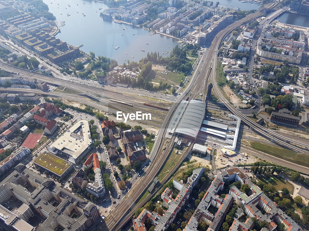 HIGH ANGLE VIEW OF CITY STREET AND BUILDINGS AT HIGHWAY