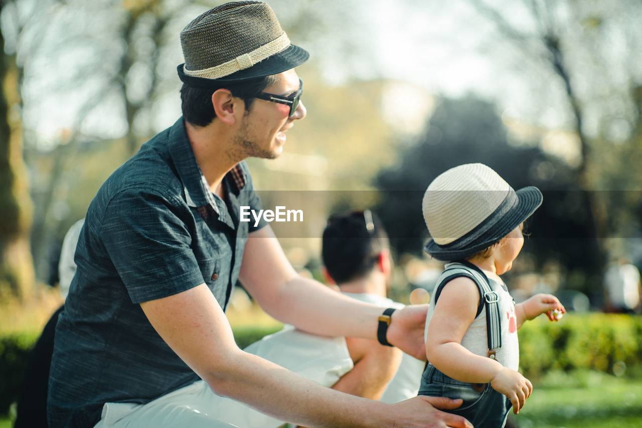 Close-up of man and baby girl outdoors