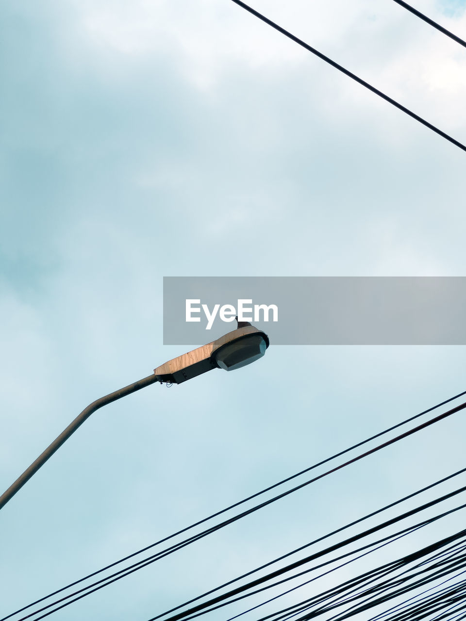 low angle view of street light against sky