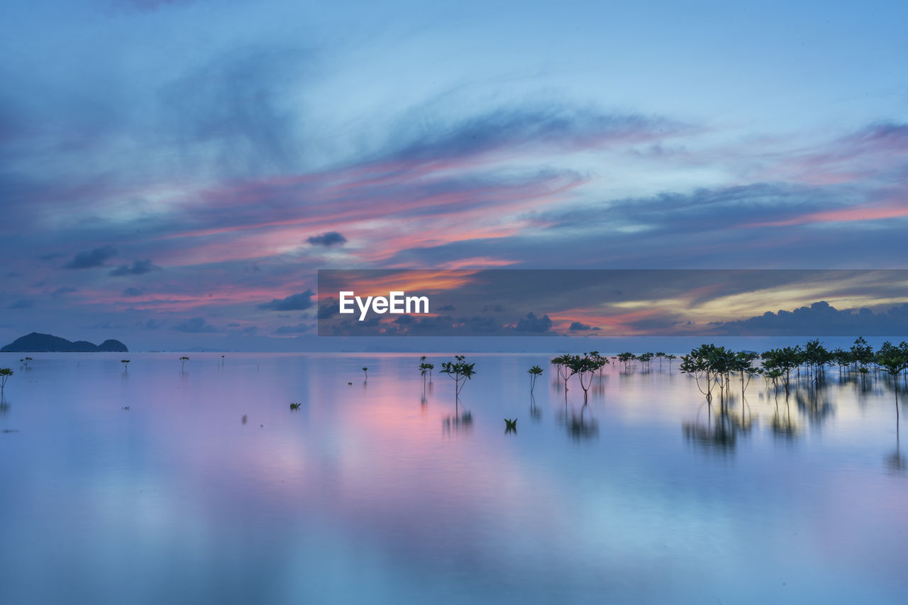 Scenic view of sea against sky at sunset