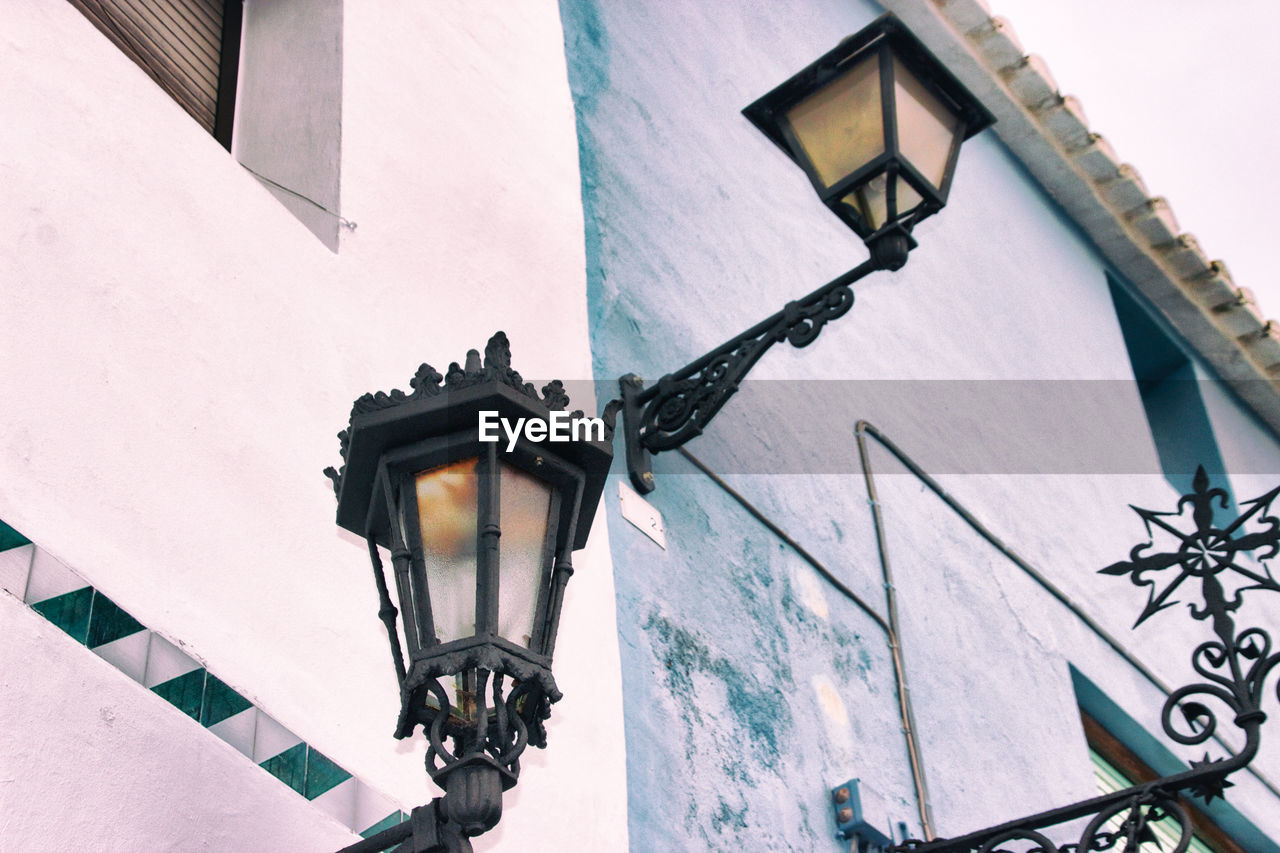 Low angle view of gas light against sky