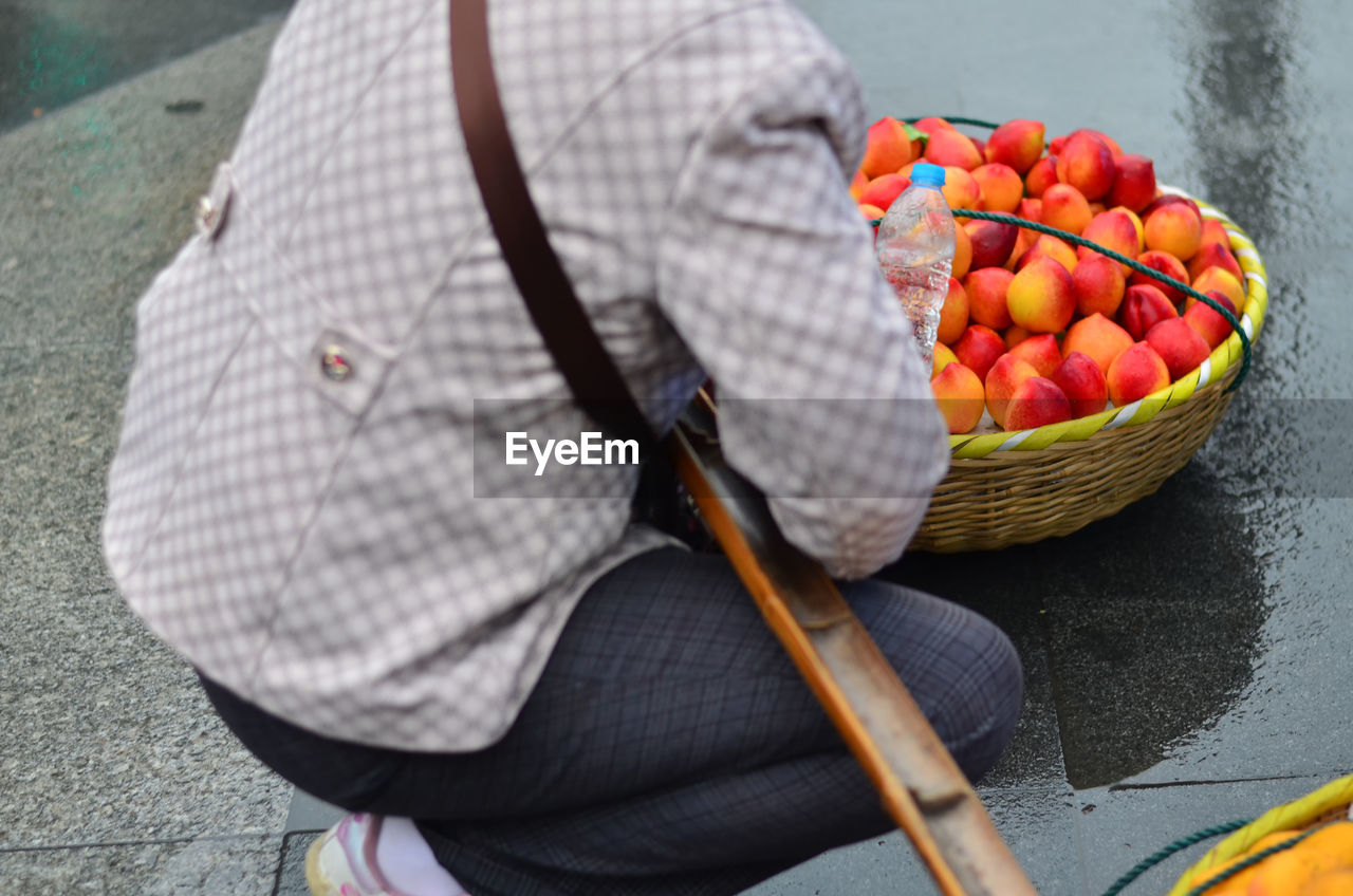 HIGH ANGLE VIEW OF MAN AND WOMAN IN BASKET