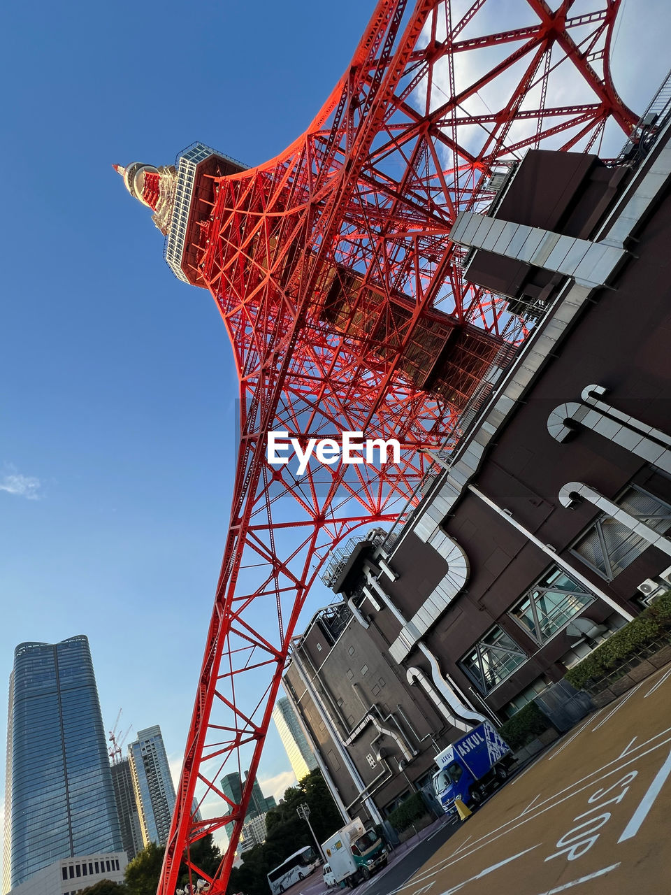 architecture, built structure, sky, landmark, city, building exterior, nature, tower, transportation, low angle view, skyscraper, travel destinations, industry, stadium, no people, outdoors, vehicle, business finance and industry, sport venue, clear sky, business, red, day, building, blue, machinery, crane - construction machinery, urban area