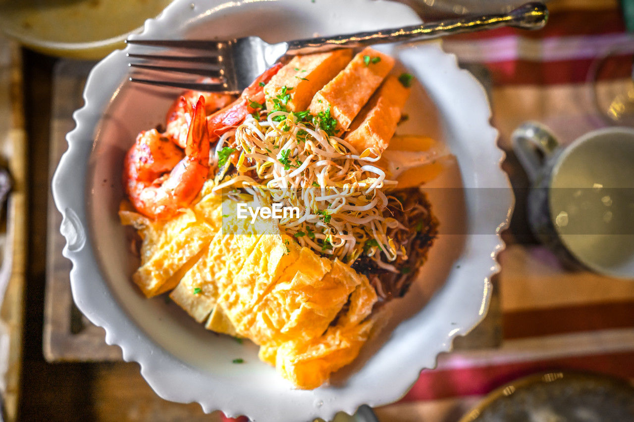 Bowl of delicious pad thai with shrimp and tofu.