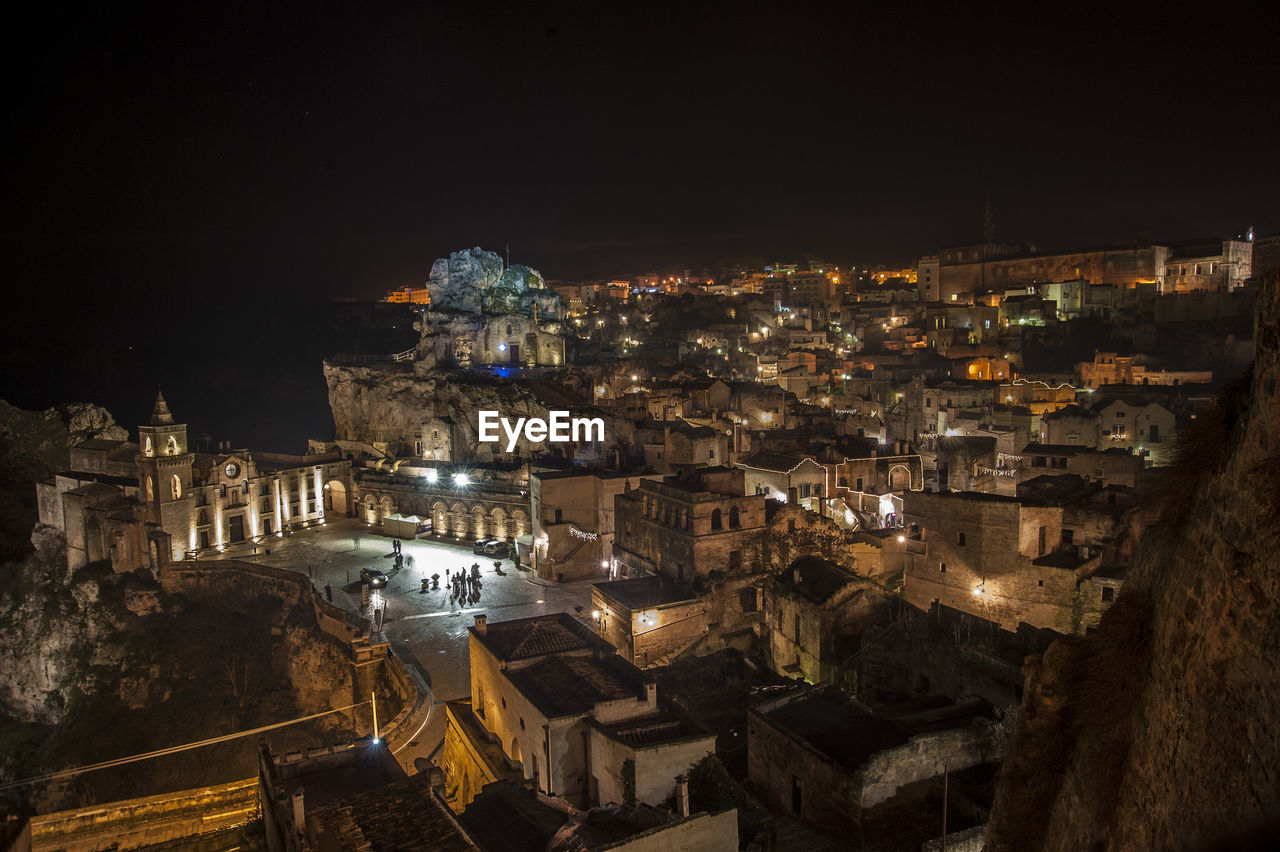 High angle view of illuminated buildings in town at night