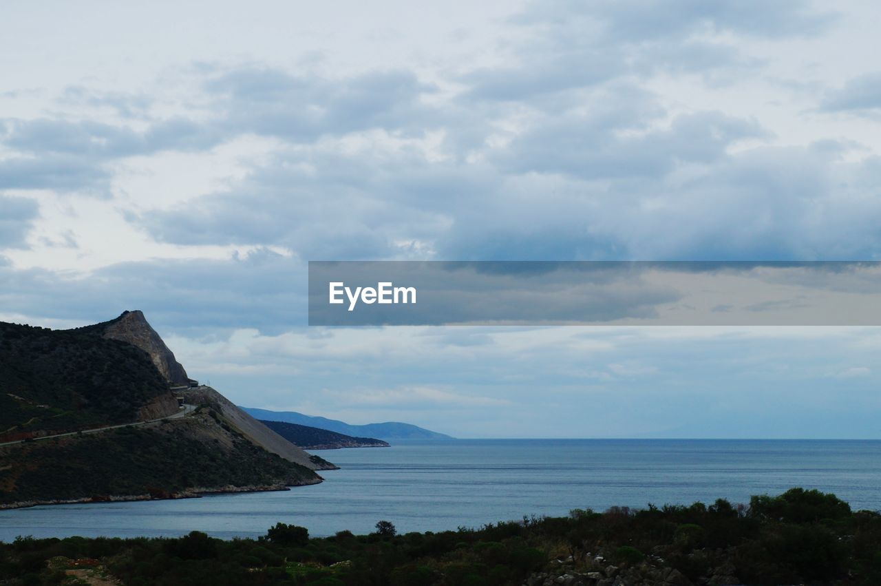 SCENIC VIEW OF CLOUDY SKY OVER SEA