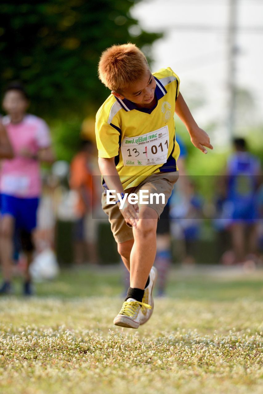 Boy running in marathon