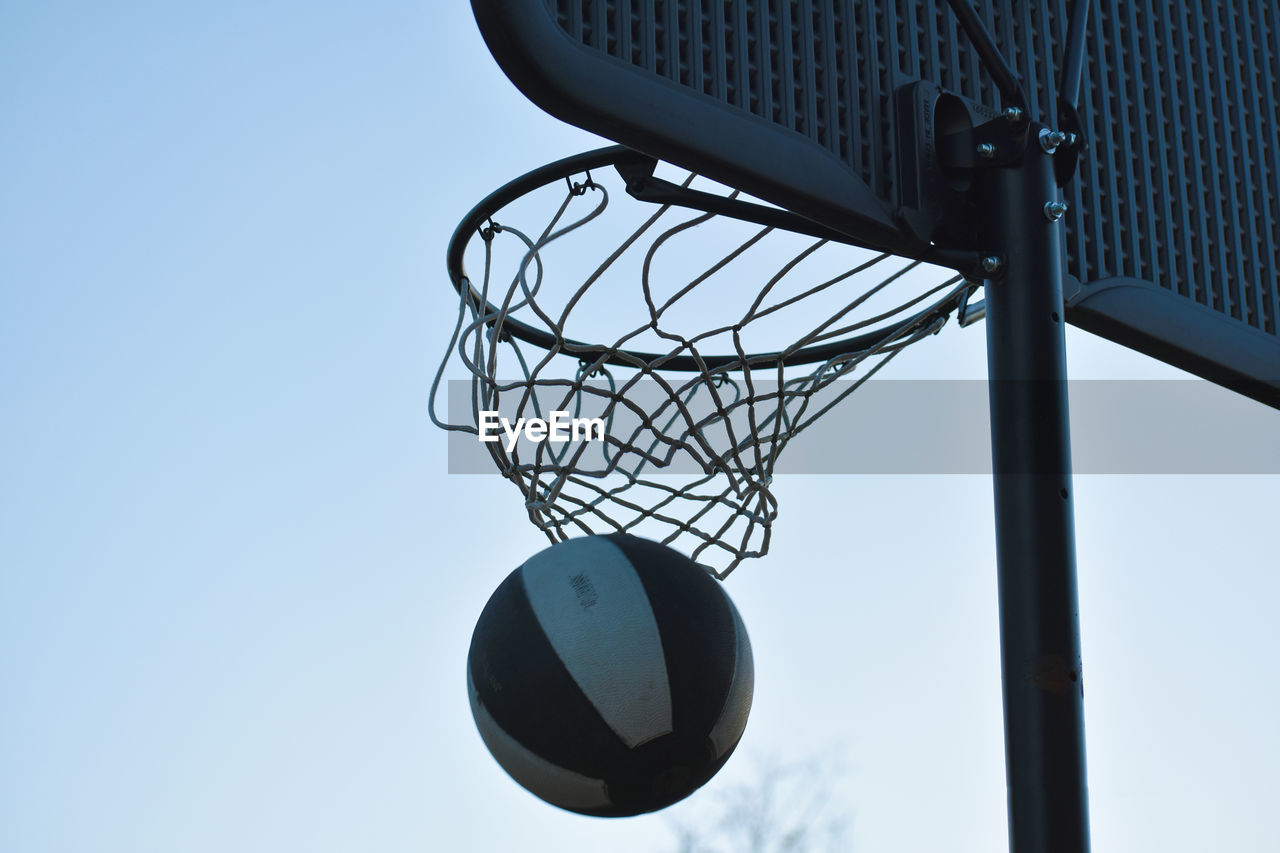 Low angle view of basketball hoop against sky