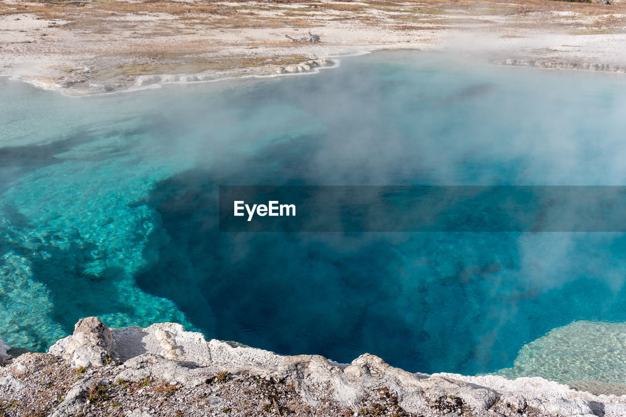 Brilliant blue thermal pool in yellowstone national park