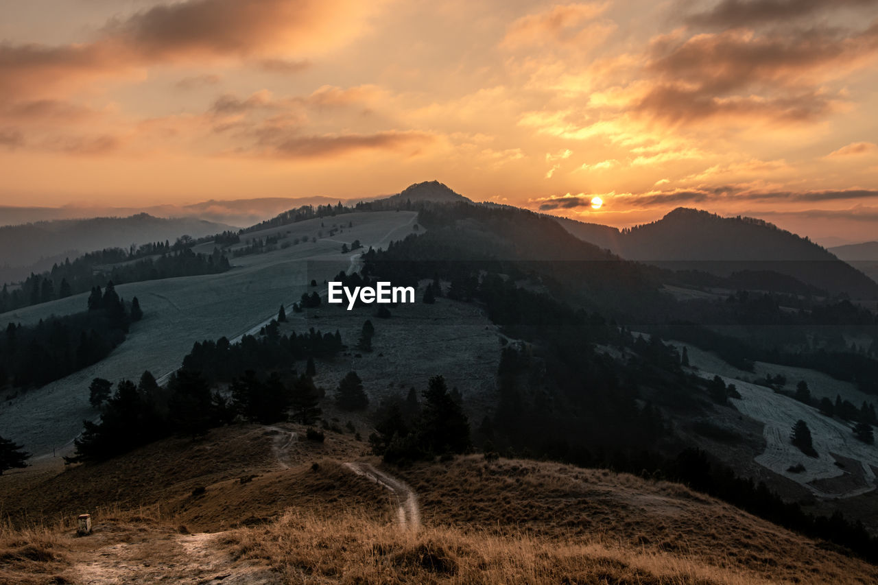 Scenic view of mountains against sky during sunset