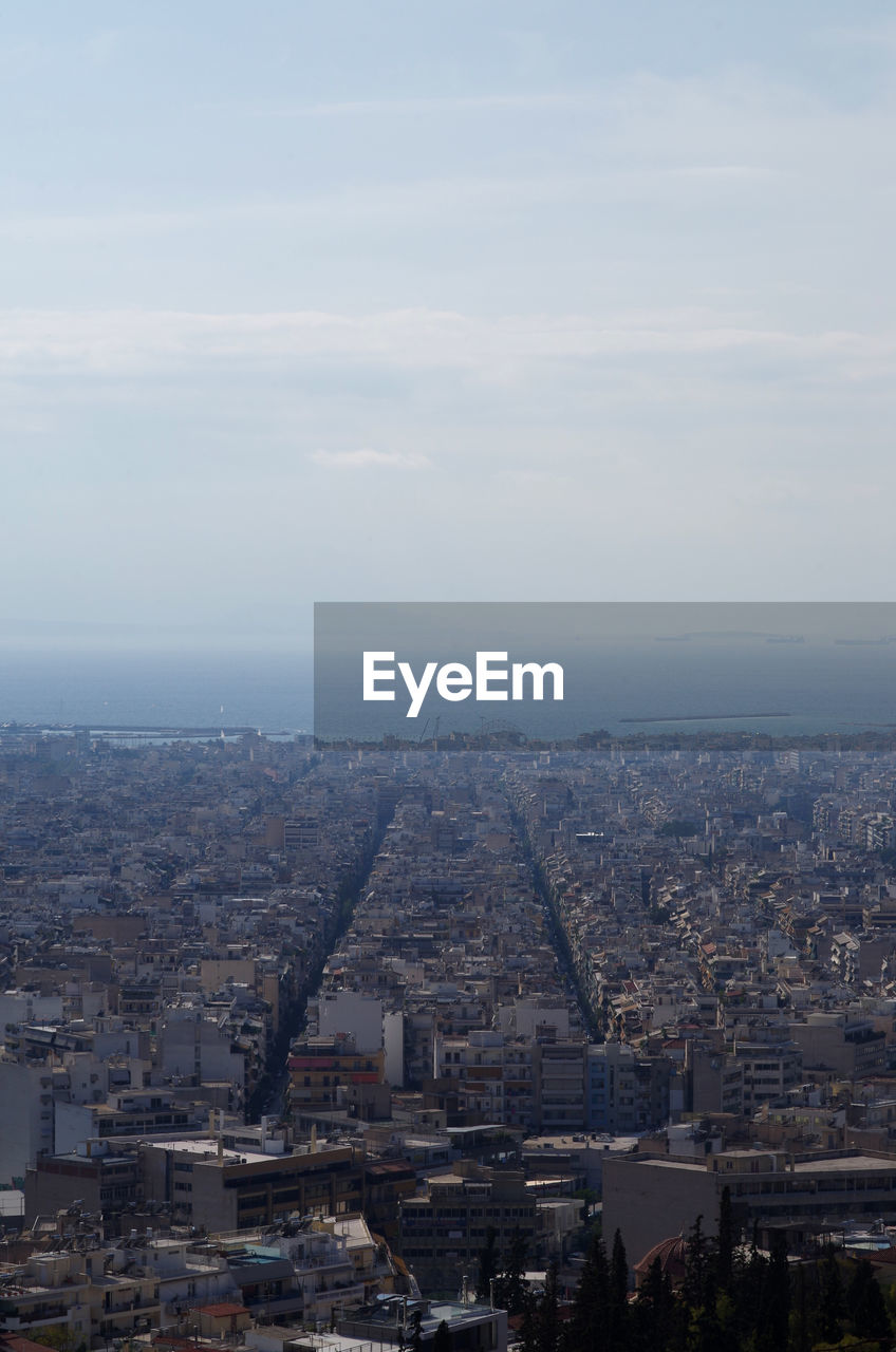 Aerial view of cityscape against sky