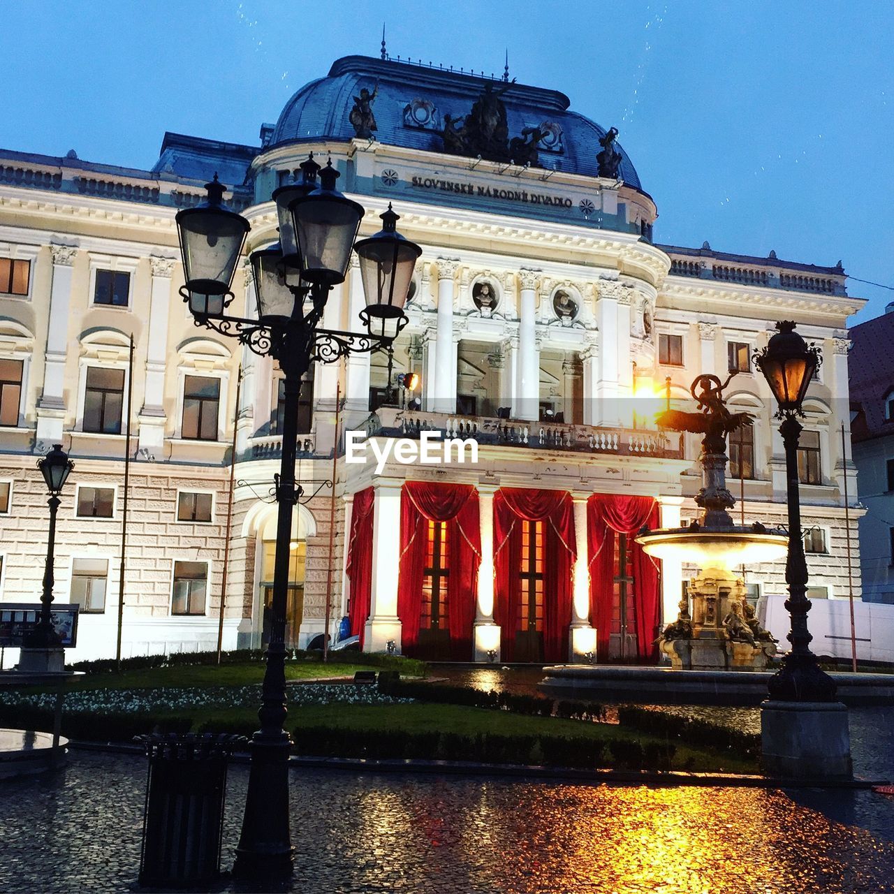 building exterior, architecture, built structure, water, building, nature, sky, city, travel destinations, illuminated, waterfront, history, the past, tourism, travel, reflection, sculpture, outdoors, statue, architectural column, no people, canal