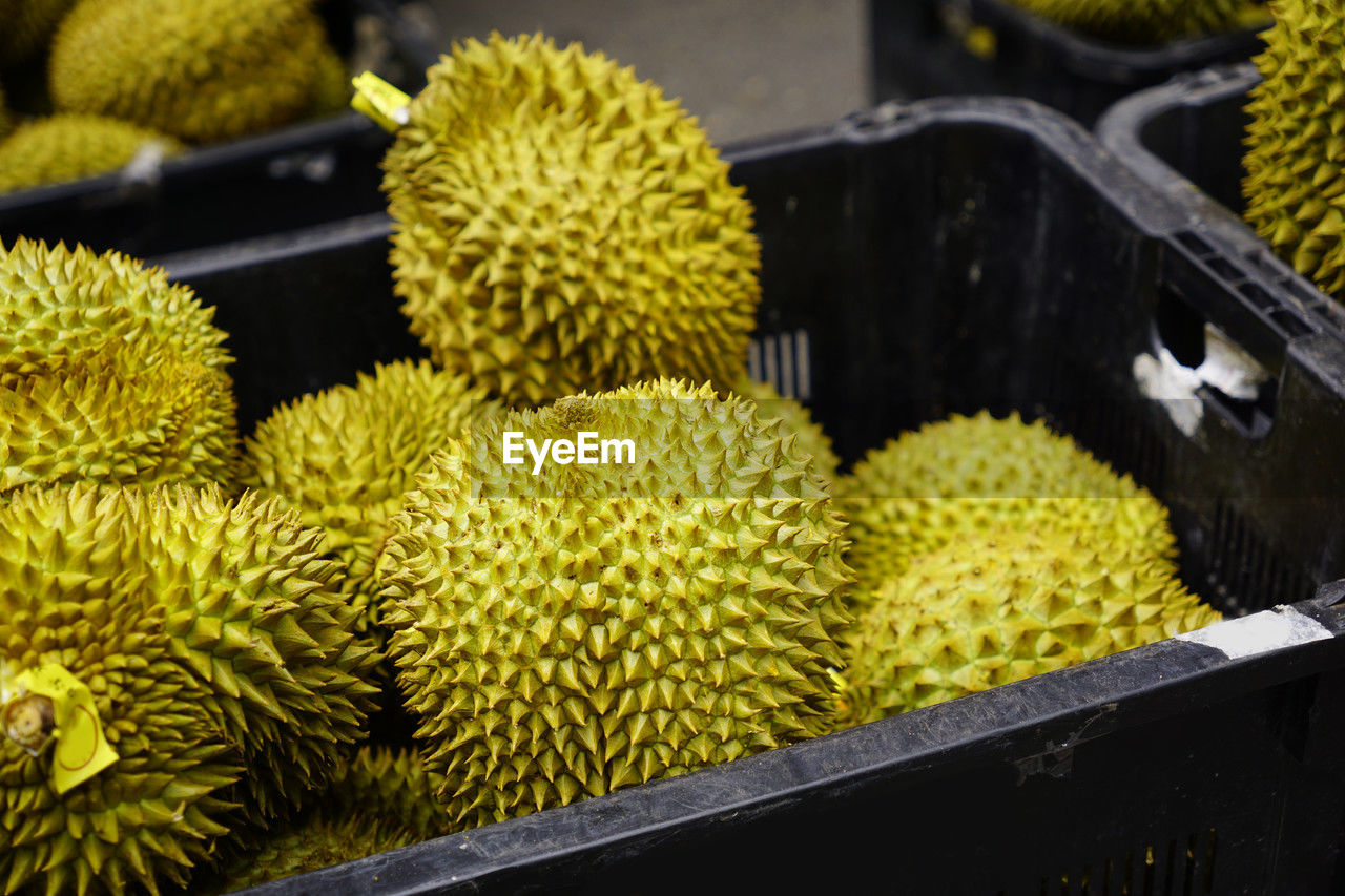 Fresh vibrant durian basket sold at a chinese market in singapore