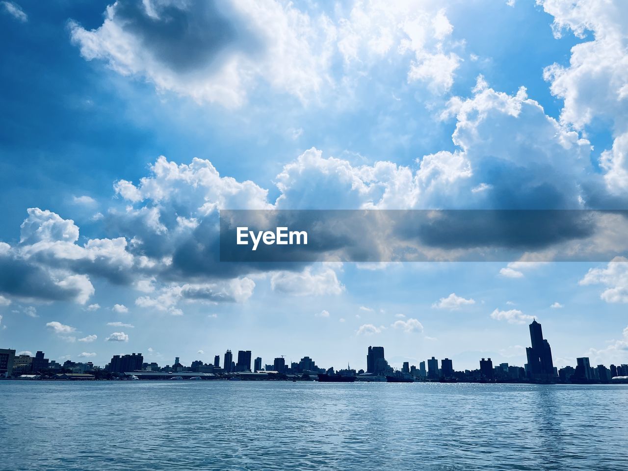 horizon, sky, cloud, water, architecture, city, built structure, nature, sea, landscape, building exterior, dusk, travel destinations, building, urban skyline, travel, reflection, blue, skyline, cityscape, no people, environment, outdoors, scenics - nature, beauty in nature, ocean, bay, body of water, tourism, sunlight, city life, cloudscape, shore