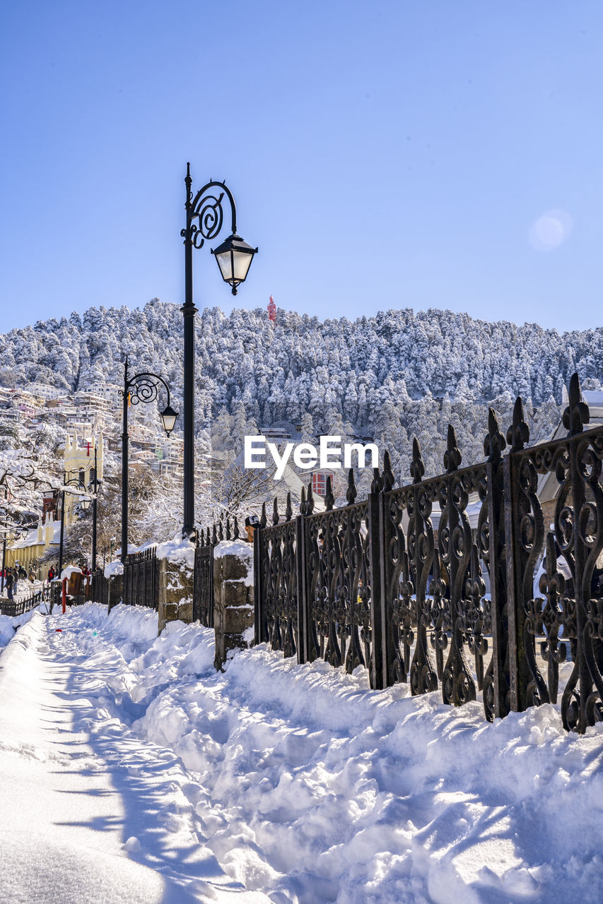Snow covered field against sky shimla mall road
