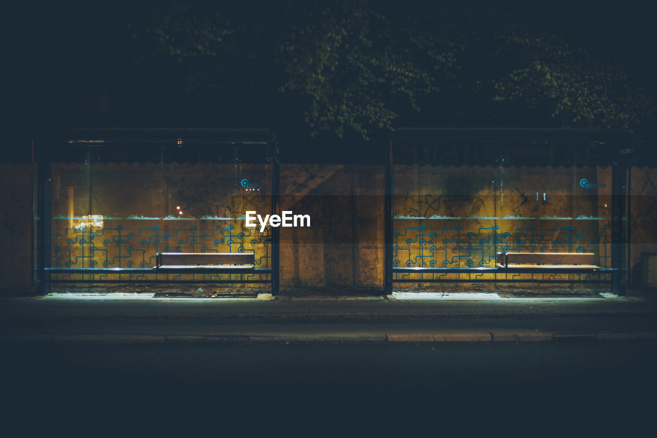 Illuminated bus stops at night