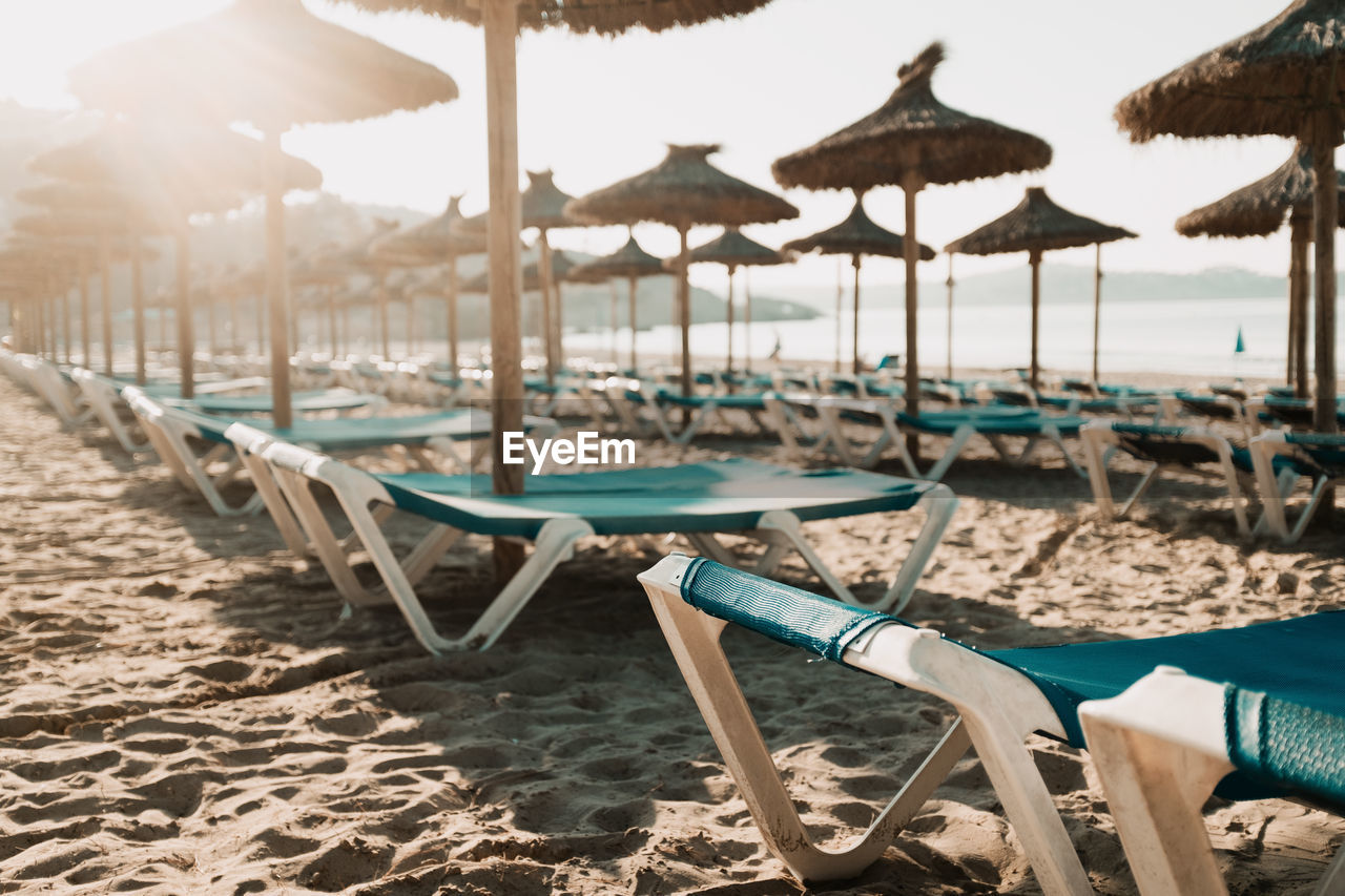 Lounge chairs and parasols on beach