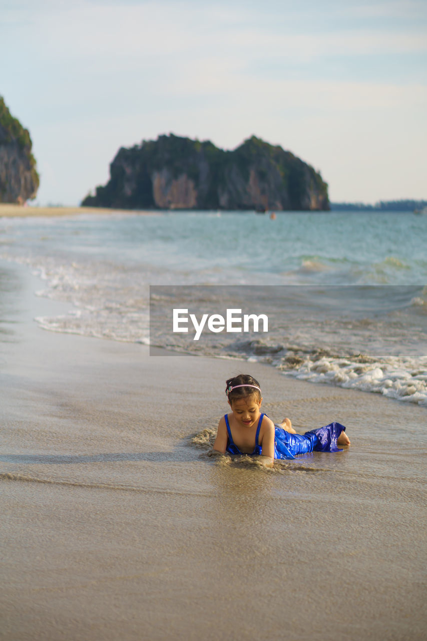 Girl playing at beach