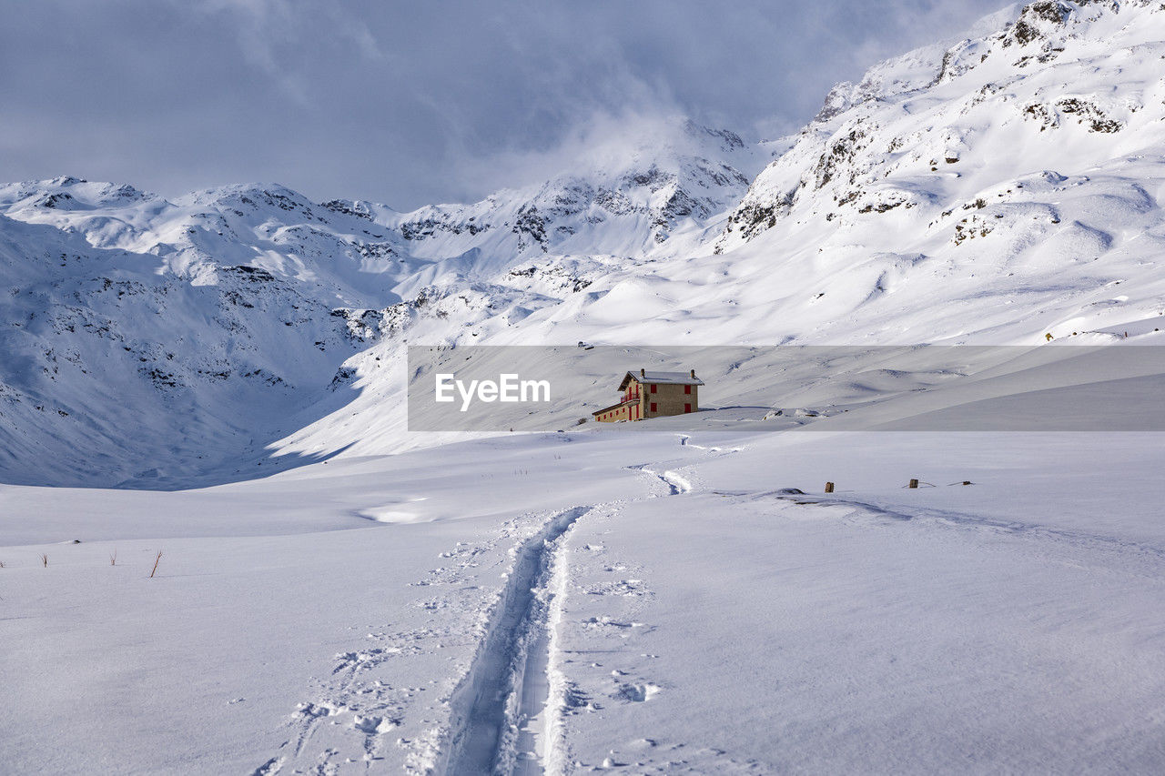 snow covered mountain against sky