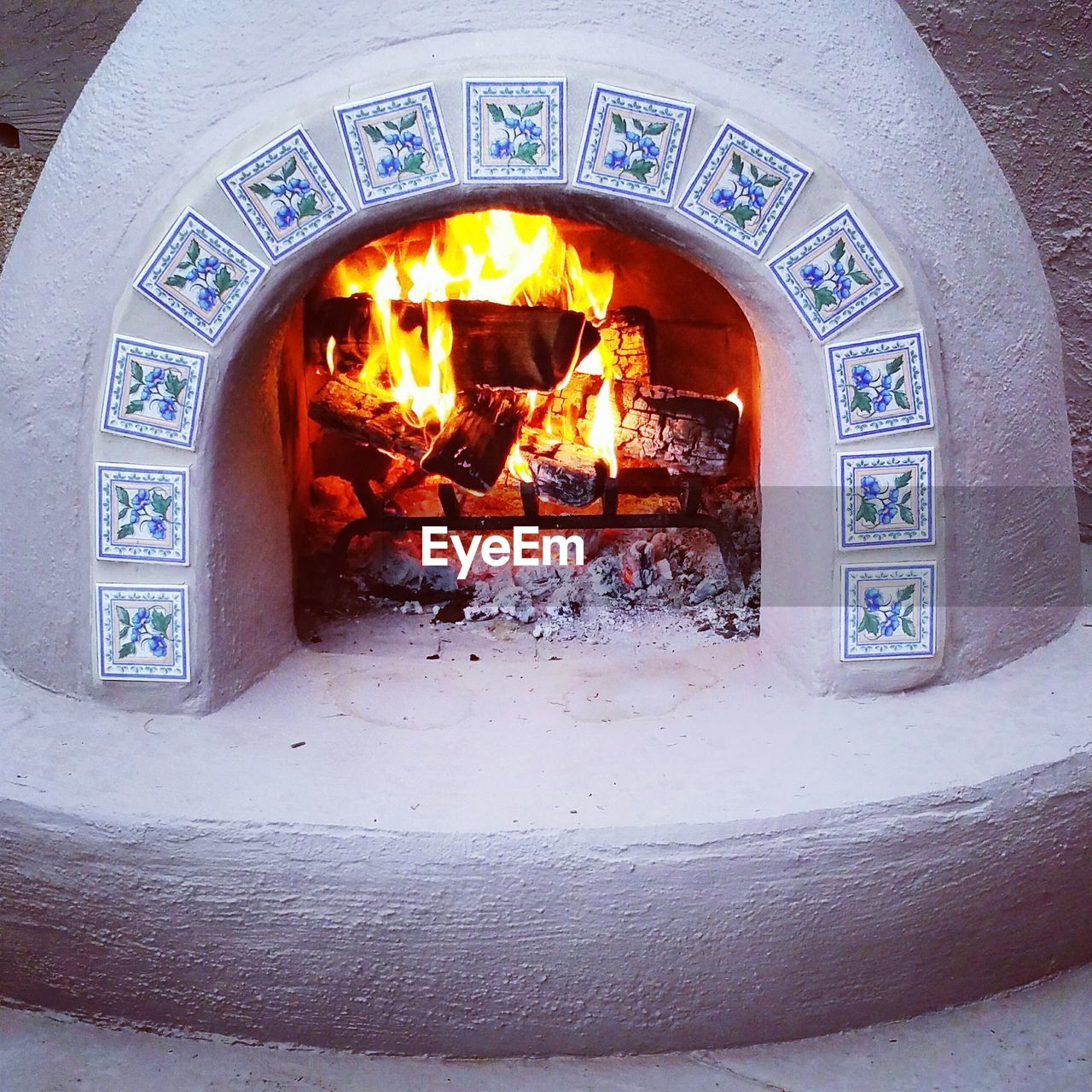 CLOSE-UP OF BURNING CANDLES IN KITCHEN