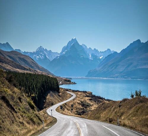 ROAD LEADING TOWARDS MOUNTAINS