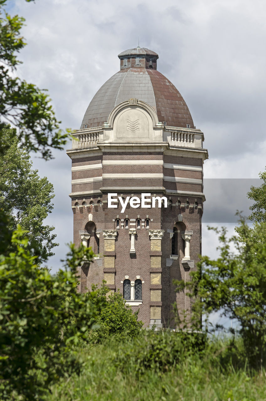 Historicv watertower amidst trees