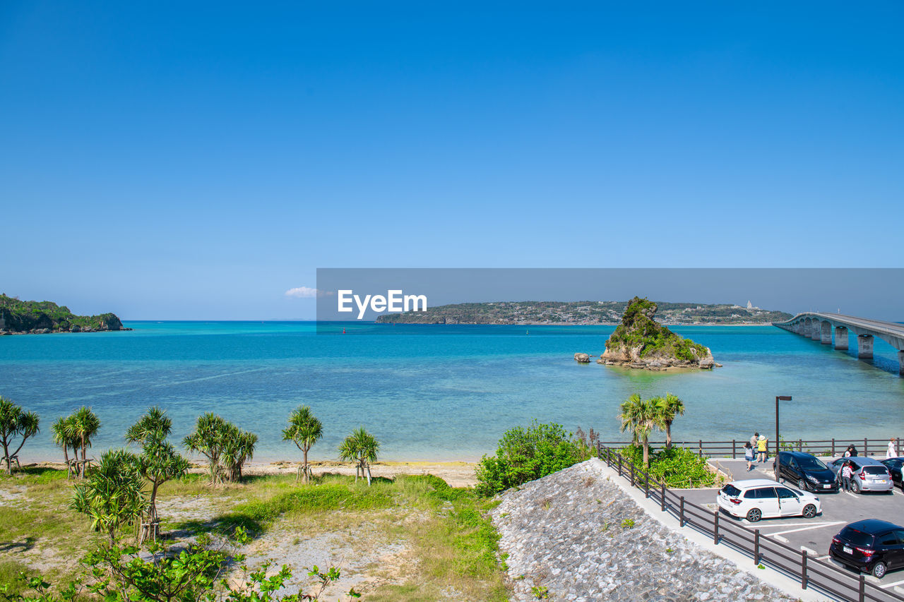 Scenic view of sea against clear blue sky