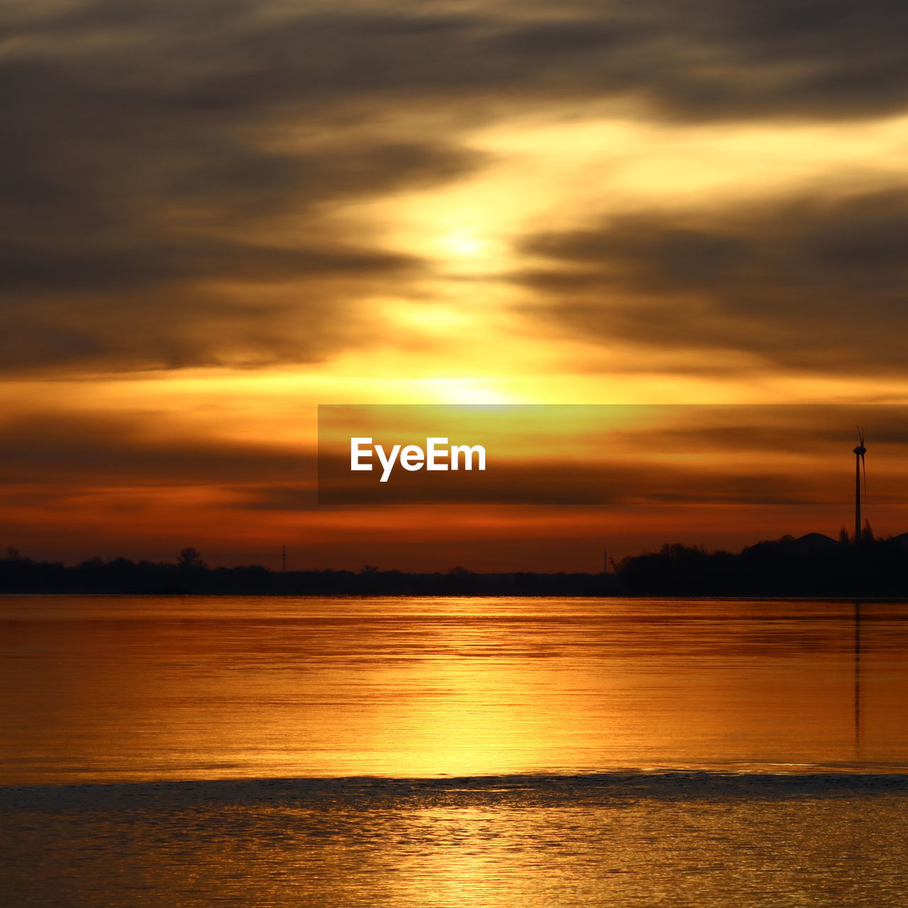 Scenic view of sea against orange sky