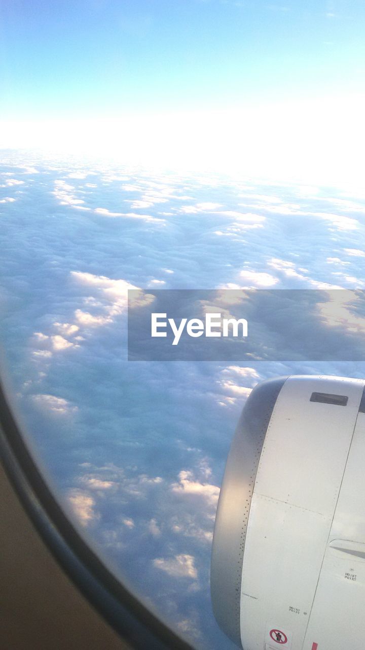 AERIAL VIEW OF AIRCRAFT WING OVER SEA