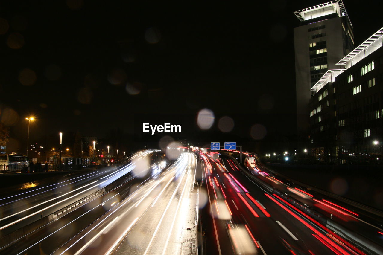 Light trails on city street at night