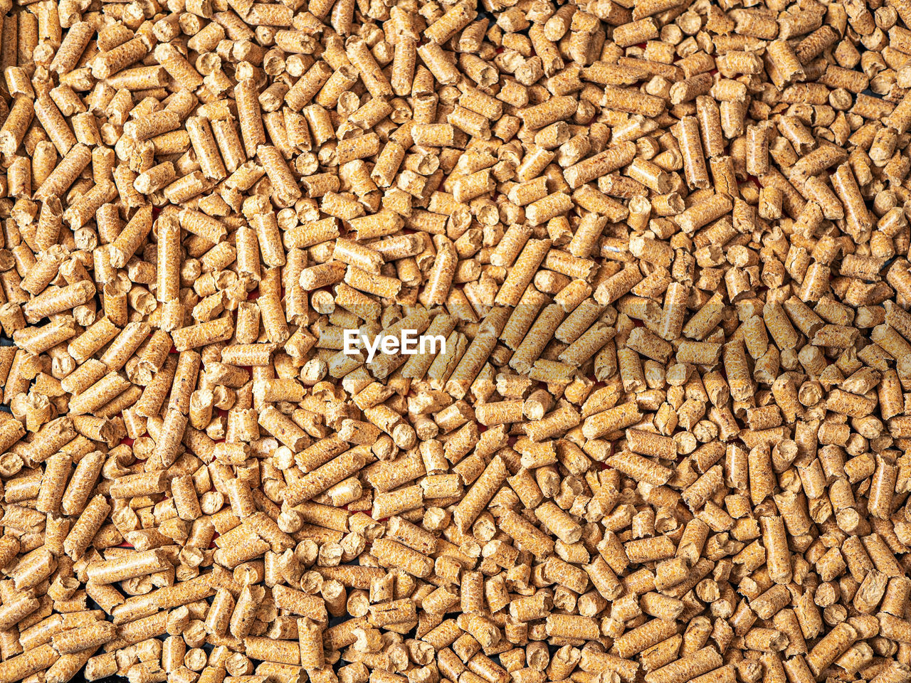 Natural wooden pellets background as renewable energy. close-up wood pellet pattern. top view