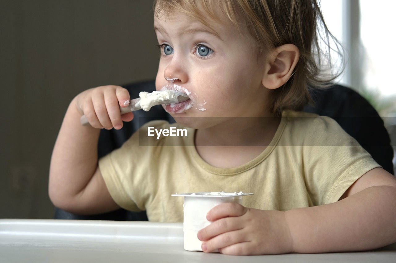 close-up of boy eating food