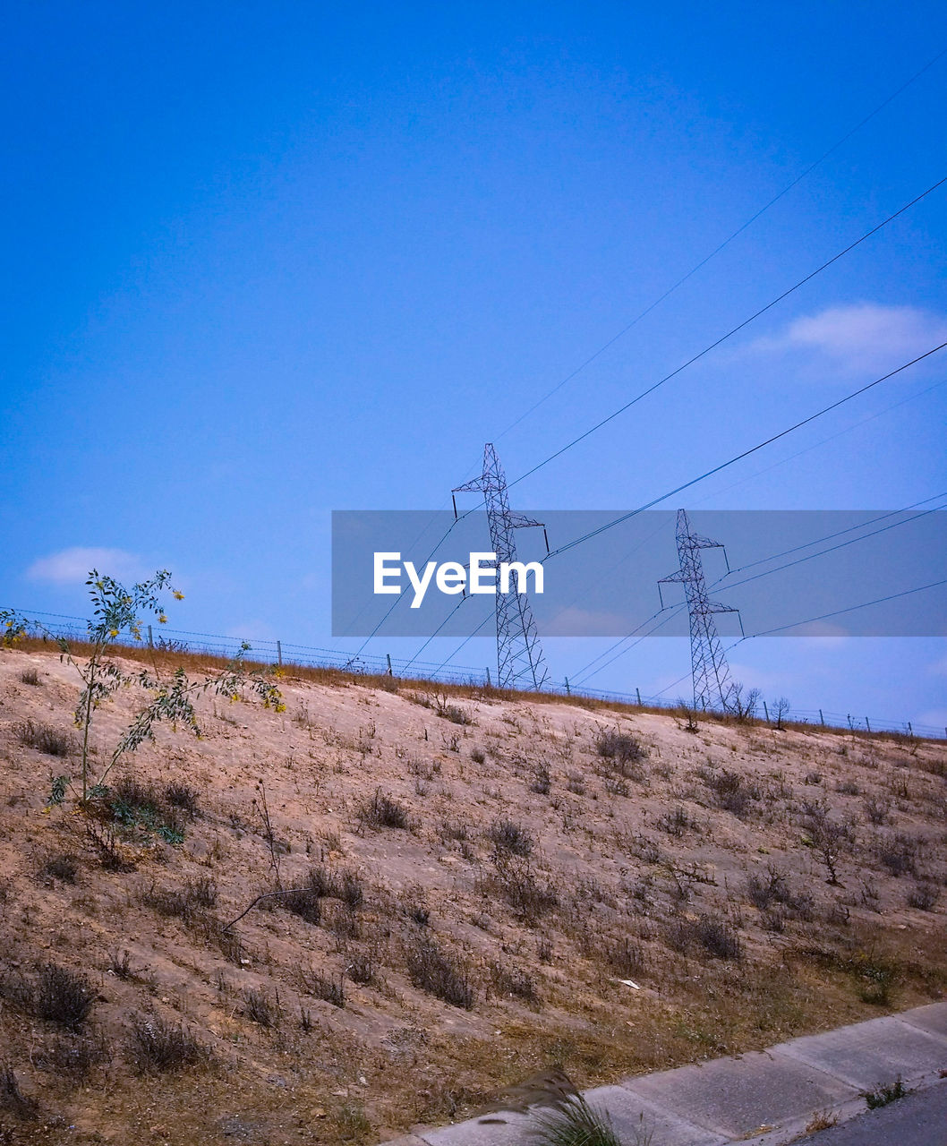 ELECTRICITY PYLON AGAINST CLEAR SKY