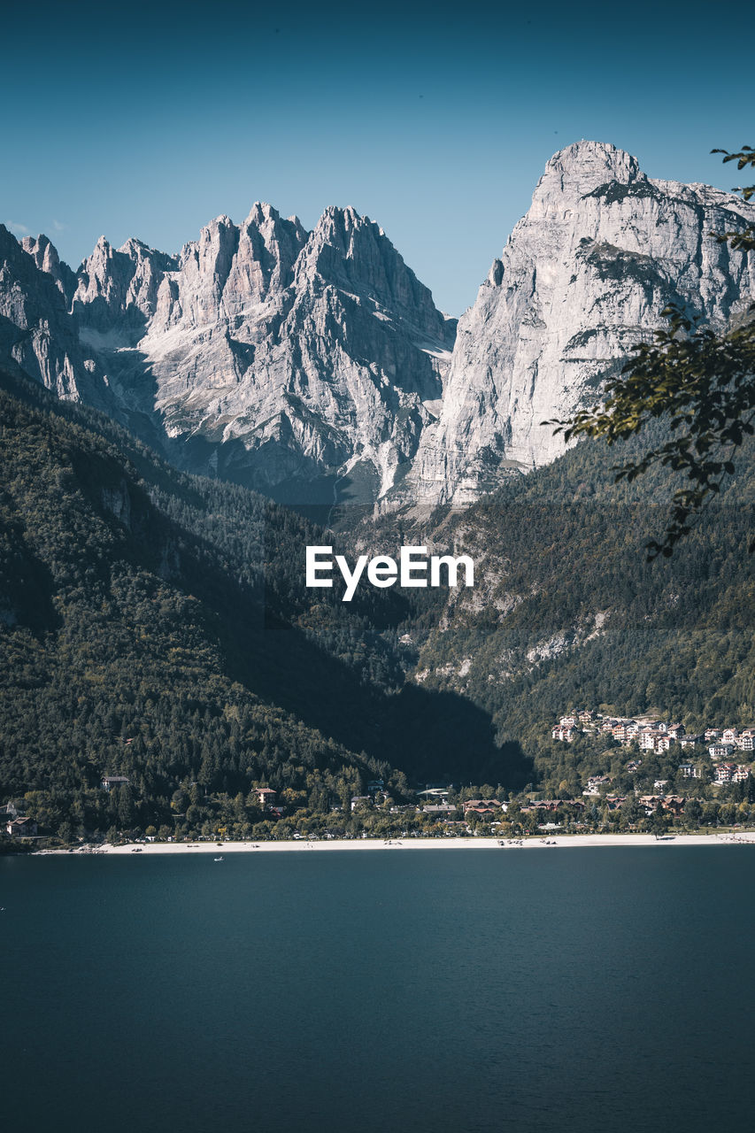 AERIAL VIEW OF SNOWCAPPED MOUNTAINS AGAINST SKY