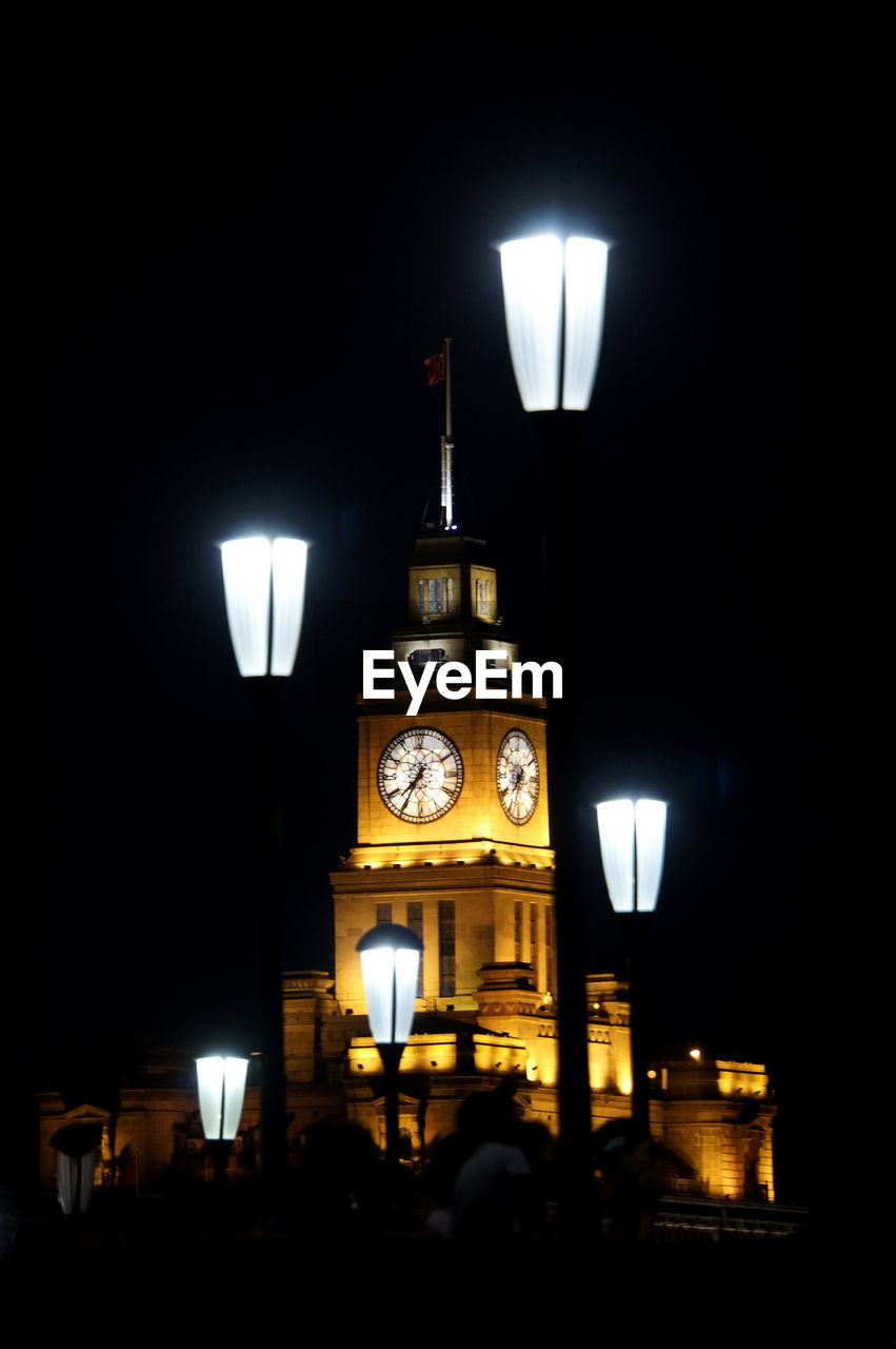 ILLUMINATED STREET LIGHTS AT NIGHT