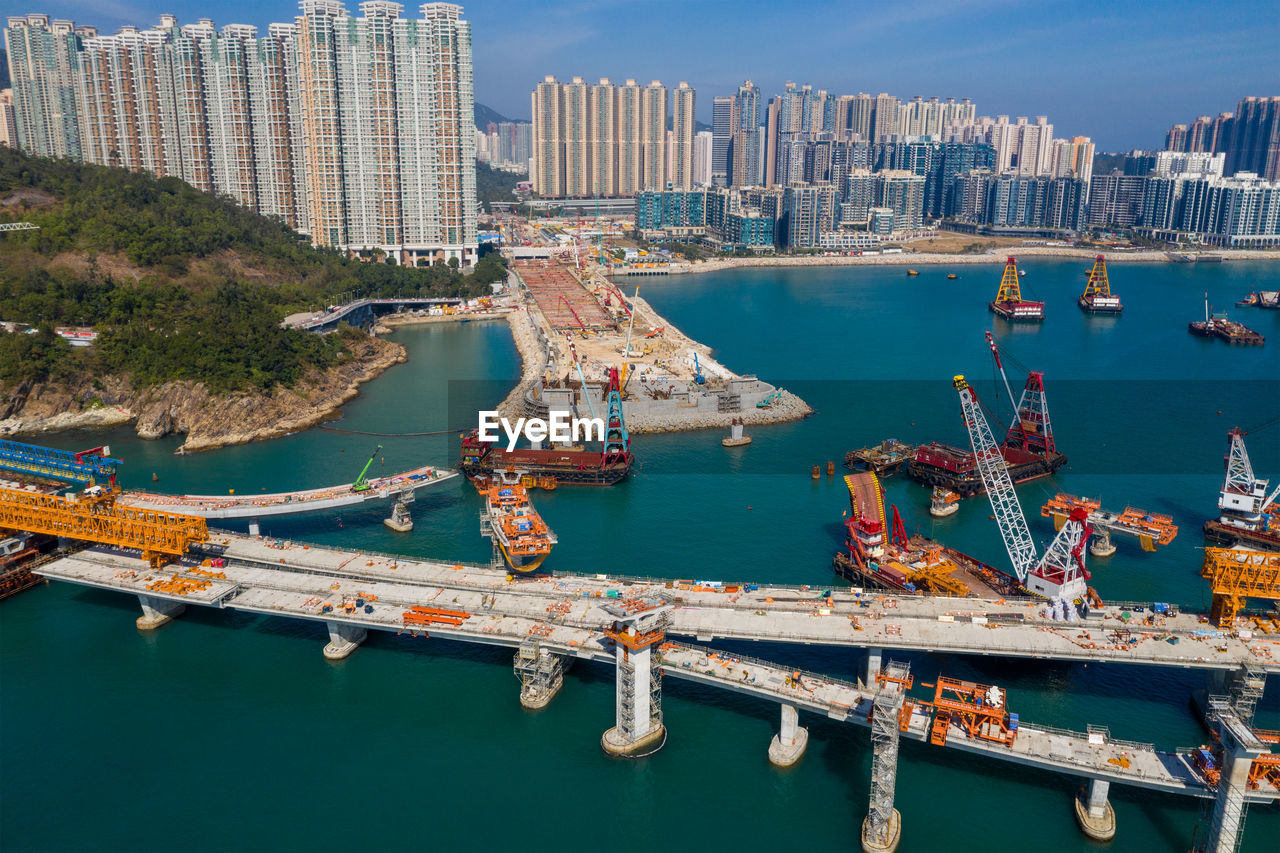 HIGH ANGLE VIEW OF BOATS MOORED AT HARBOR