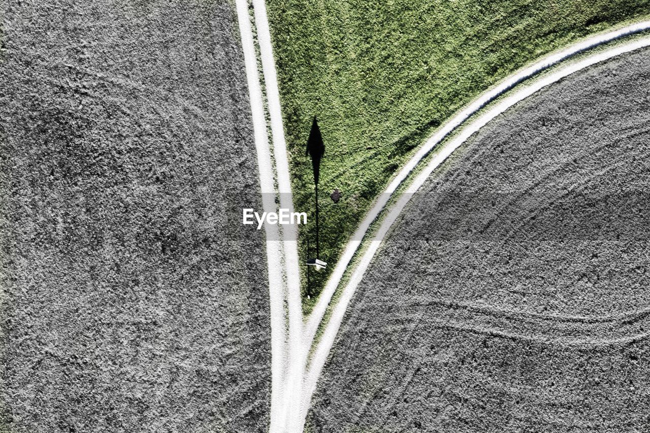 High angle view of road by field