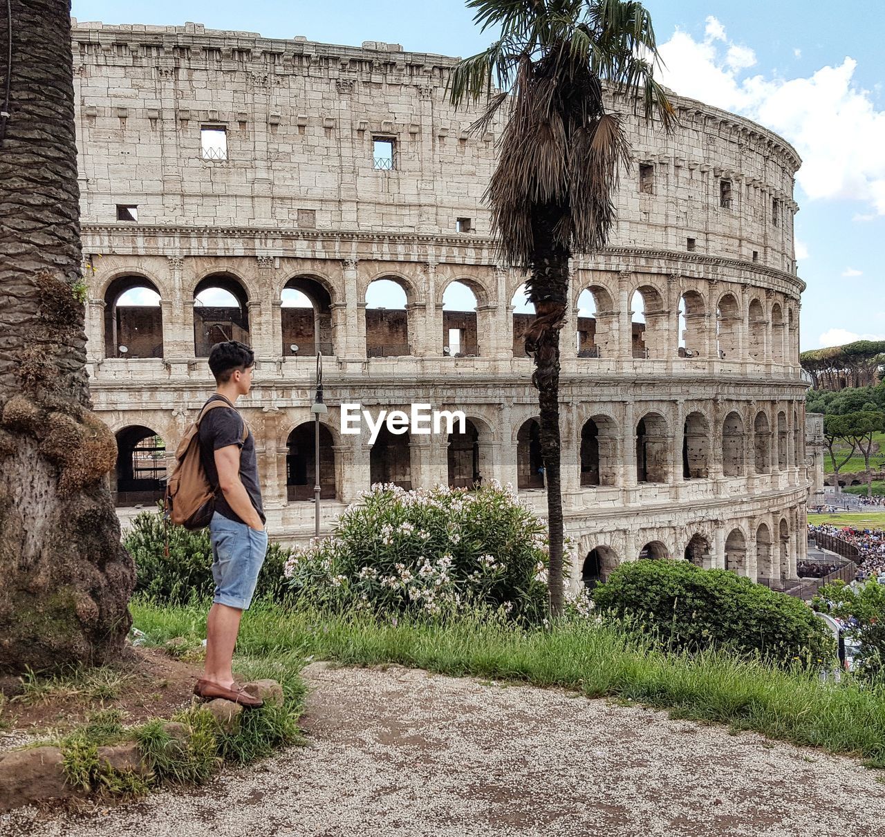 Male tourist at coliseum in rome 