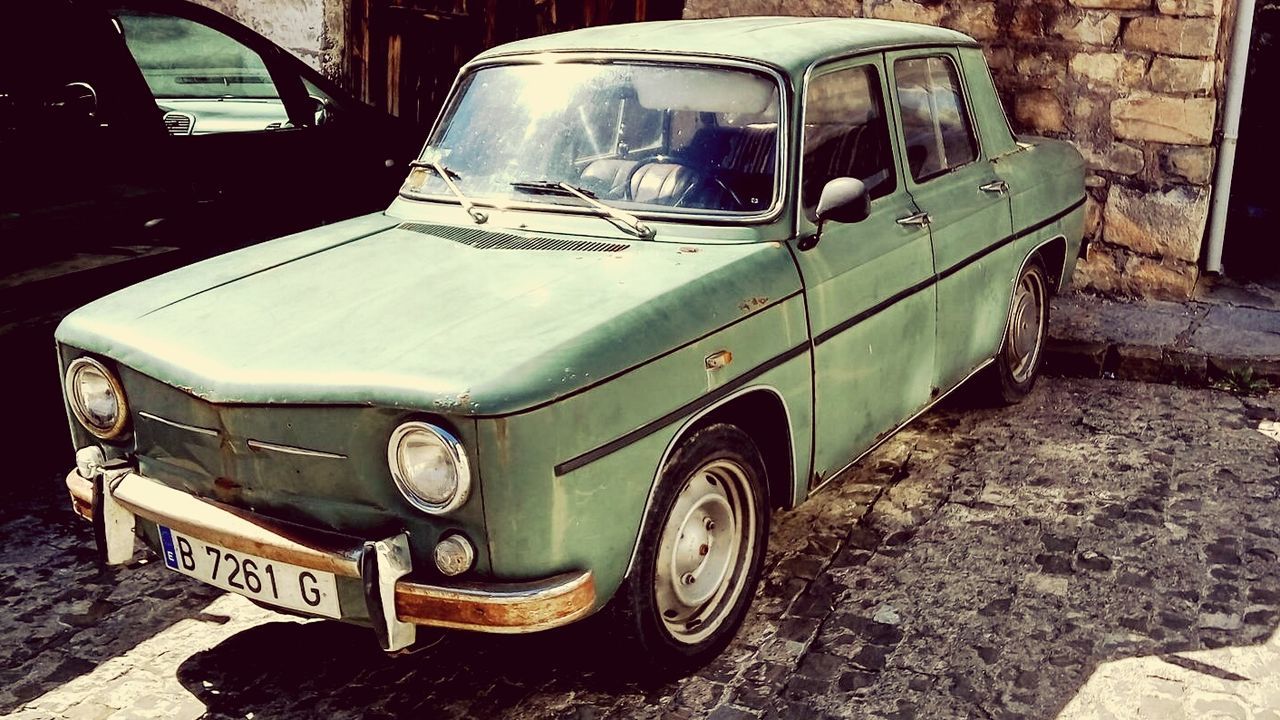 VINTAGE CAR PARKED ON STREET