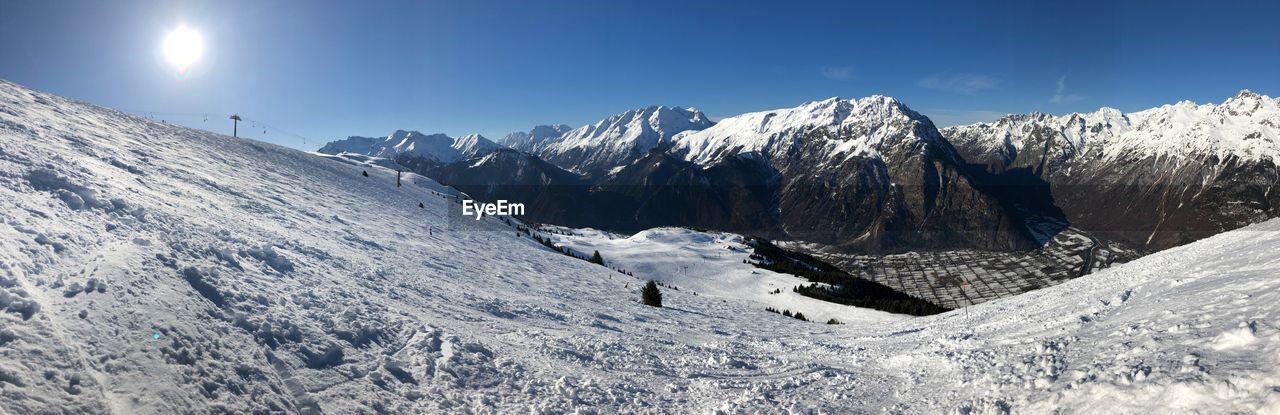 Scenic view of snowcapped mountains against sky