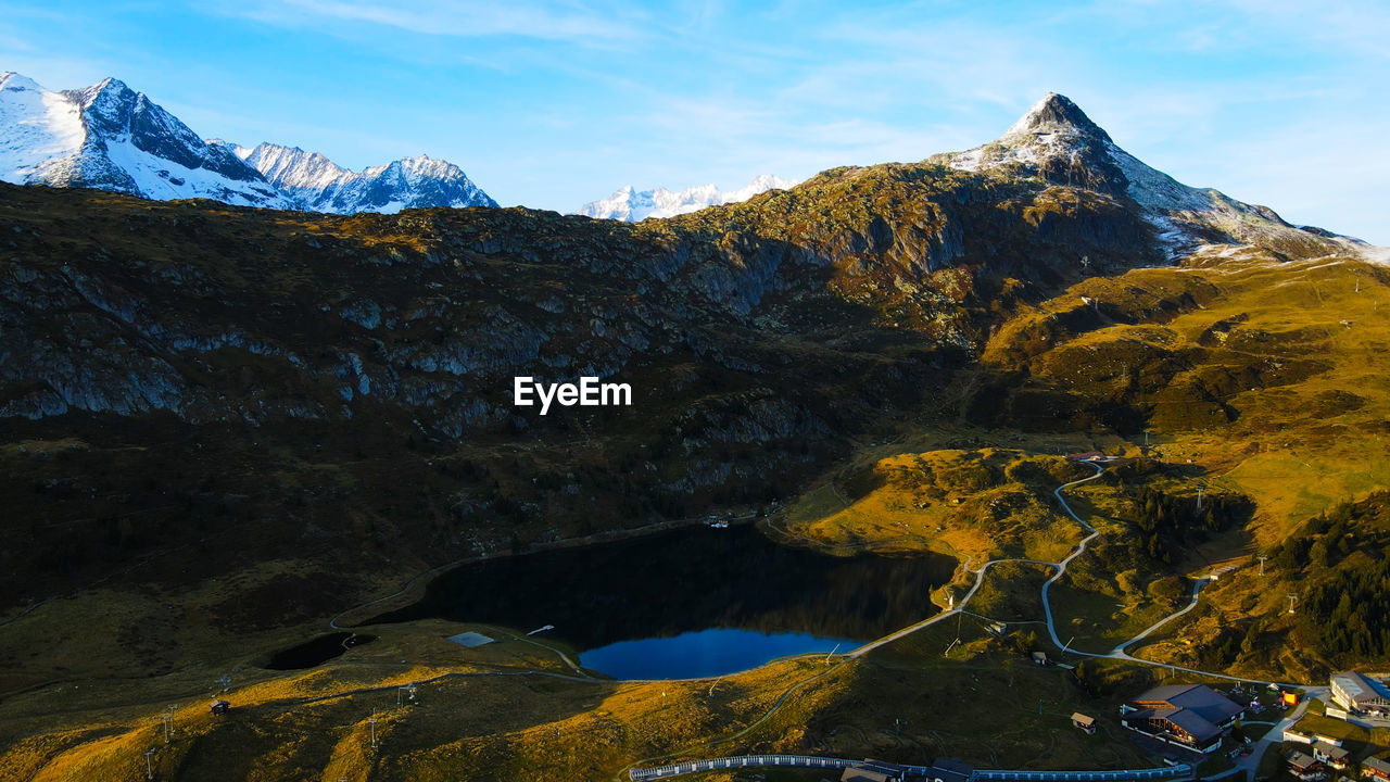 IDYLLIC VIEW OF SNOWCAPPED MOUNTAINS AGAINST SKY