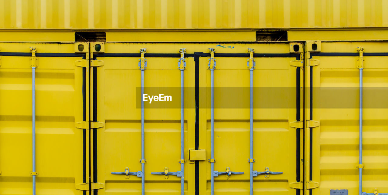 Close-up of yellow container 