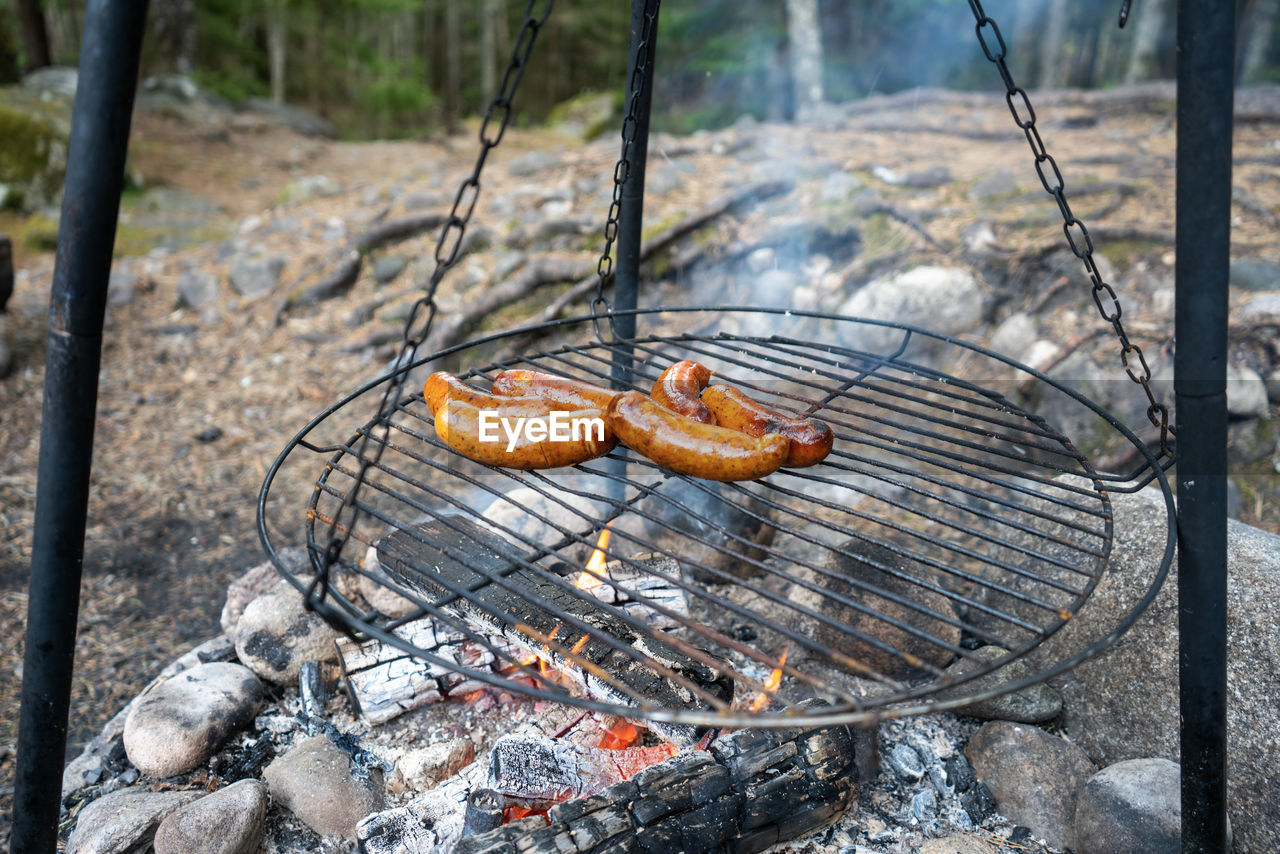 High angle view of sausages on outdoor grill