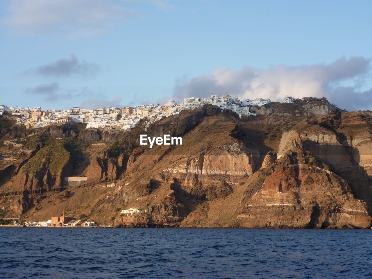 Panoramic view of sea and mountains against sky