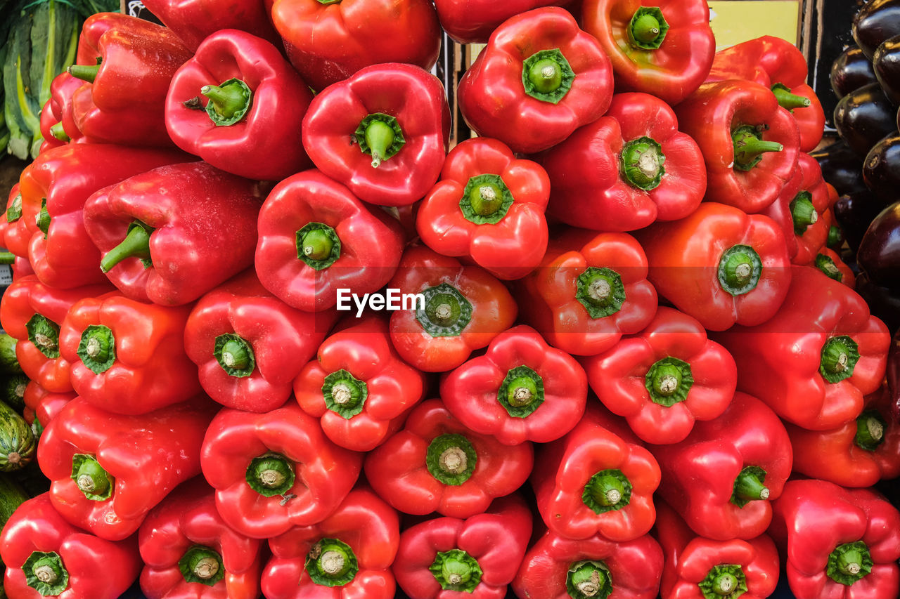 Pile of red bell pepper for sale at a market