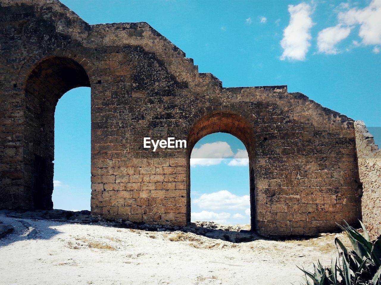 Low angle view of old ruins against sky