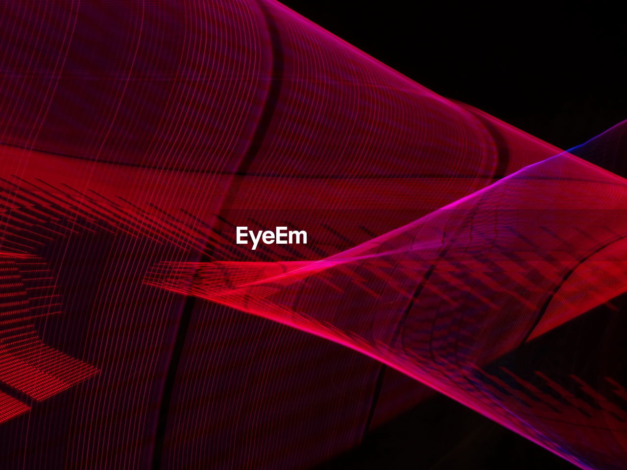 Low angle view of light painting against black background